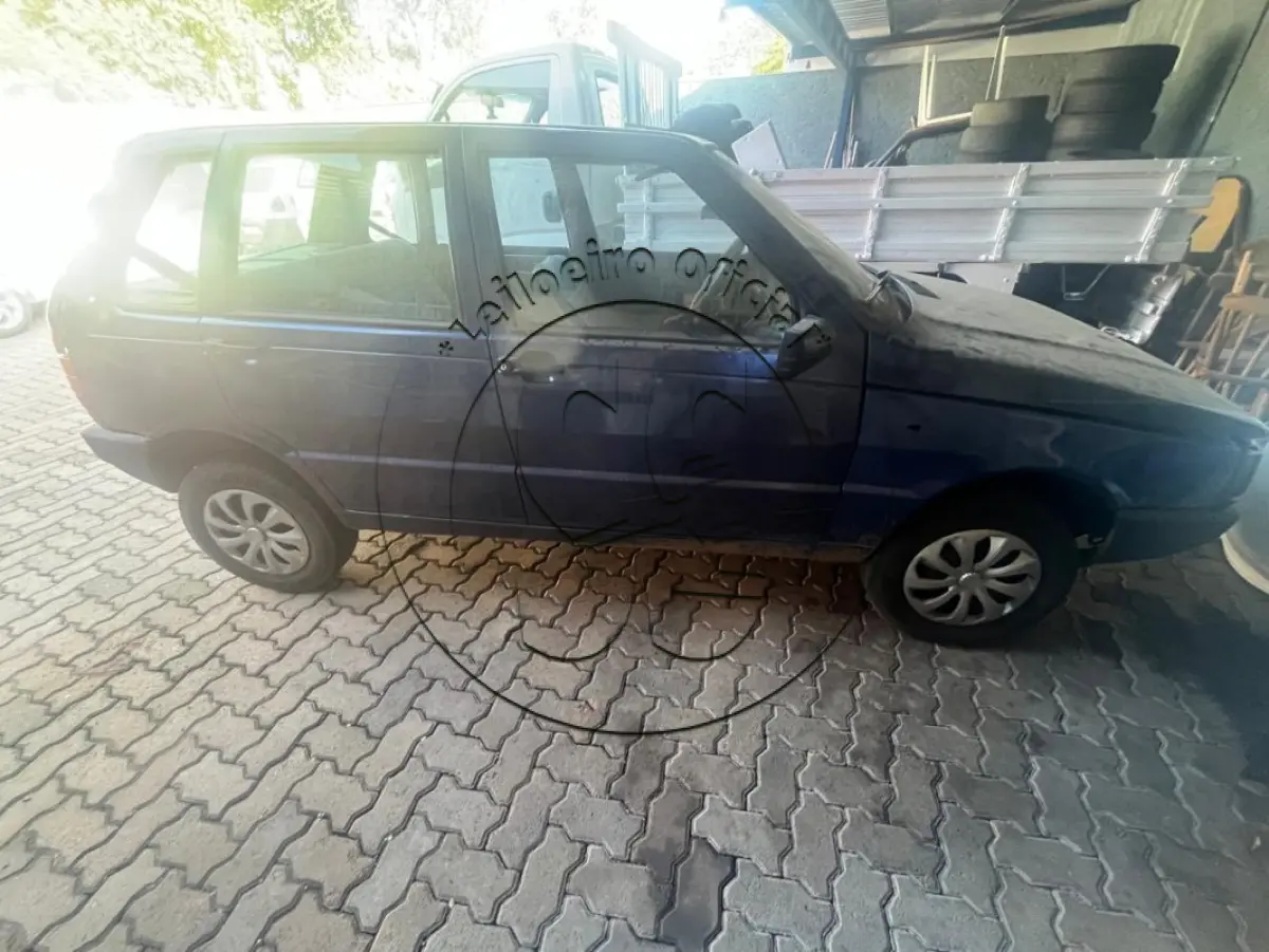 LOTE 032 - Automóvel FIAT/UNO MILLE EX, ano/modelo: 1999/1999, placa: IIY0711